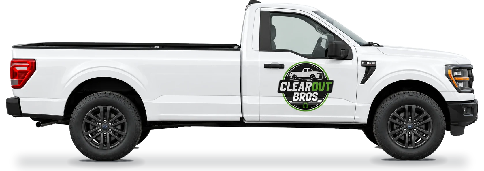 Side view of the ClearOut Bros white pickup truck with the logo on the door