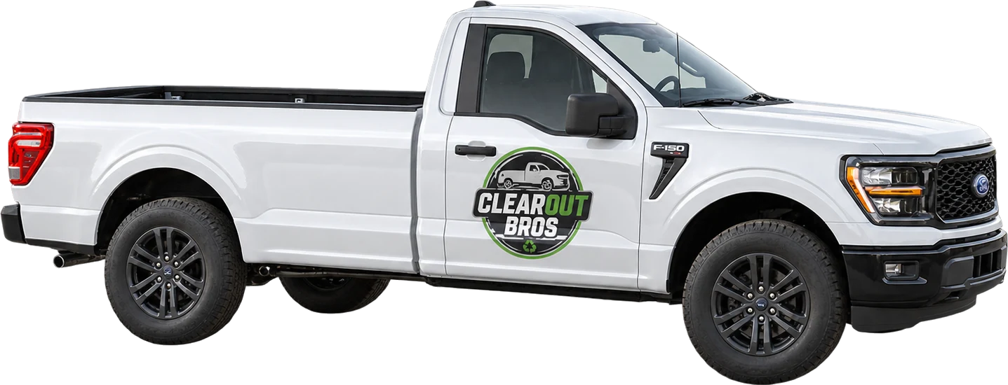 The ClearOut Bros white Ford F-150 with the logo on the door